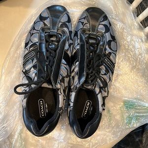 Black and grey logo coach sneakers